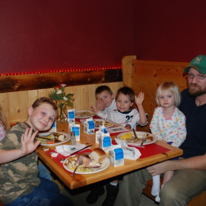 A family enjoys a Christmas Day Dinner at the RoadHouse.