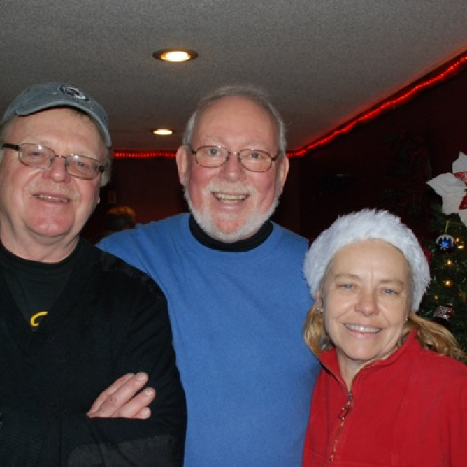 Carl Brown initiated the Annual Christmas Day Dinner in 2006 when he asked Deacon Lee Grim to rally community churches. Volunteer Etta Johnson served at one of the dinners.